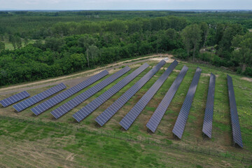 Aerial view of the huge solar power plant. Alternative clean green energy using renewable solar energy. Drone photo Solar panels in Europe, Hungary.
