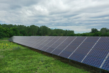 Renewable solar power plant. Aerial view as solar energy is converted by solar cells into electrical current. Alternative clean green energy renewable solar energy use. In Europe, Hungary.