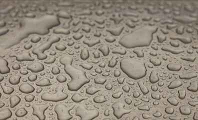 Fototapeta na wymiar Beautiful background texture of rain water drops on grey black metal surface. Beautiful backgrounds.