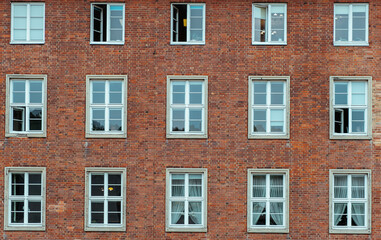 White window on a red brick wall