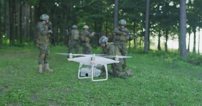 Army engineer using drone to monitor enemy and complete military action