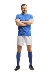 Footballer in a blue top and white shorts posing with crossed arms