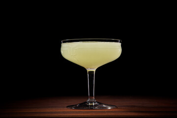 Last Word cocktail in a coupe glass on black background