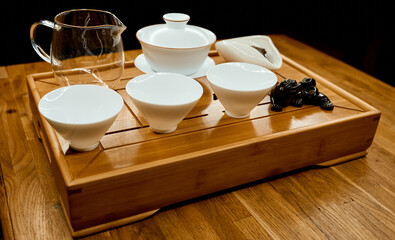 Chinese traditional tea tray with dragon on tray and empty kettle cups