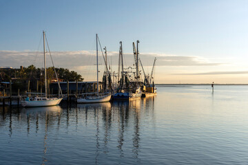 Fototapeta premium Boats at sunset at Shem Creek near Charleston, South Carolina.