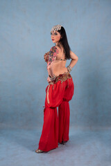 Oriental dancer in red trousers