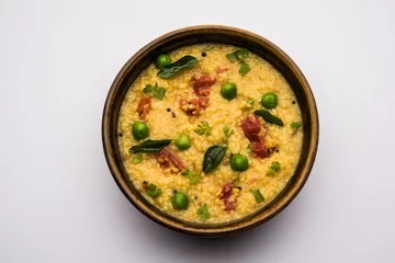 Foto op Canvas Dalia khichdi or Daliya Khichadi is a delicious one pot meal made from broken wheat and vegetables, Indian food © StockImageFactory