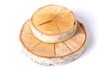 Two cracked slices of a birch trunk - thick and thin, lie on top of each other. Isolated on a white background.