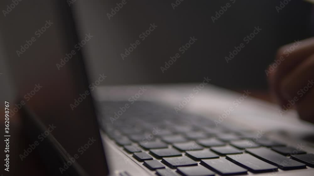 Poster man working and typing on laptop
