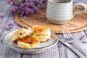 Traditional British scones with a tea cup and blurred background