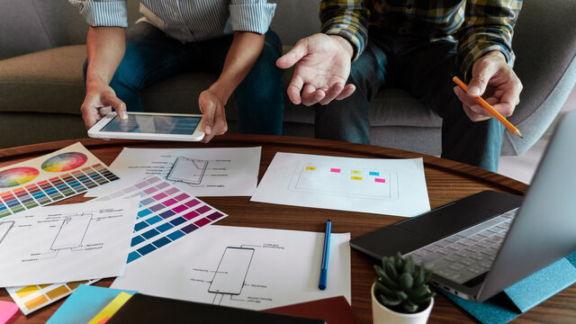 Creative team analyzing prototype products for product design in Co-working Space