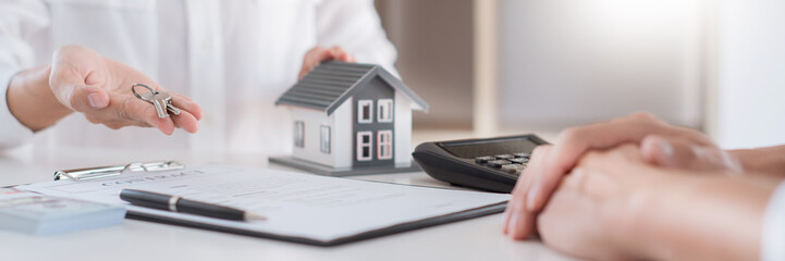 Sale agent representative offer house purchase contract to buy a property or apartment to customer
