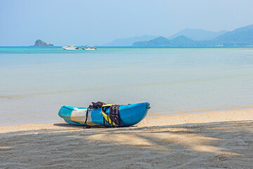 Lonely kayak on peaceful beach Koh Chang island Thailand