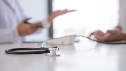 doctor giving consulting and diagnostic to patient and explaining medical information prevention...