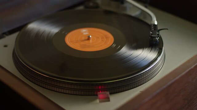 Vinyl record rotating on a turntable in slow motion