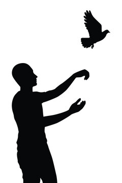 Young man releases a bird to freedom silhouette vector