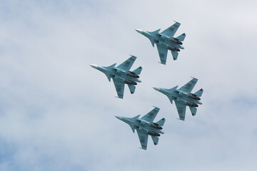 Four war jet planes in sky
