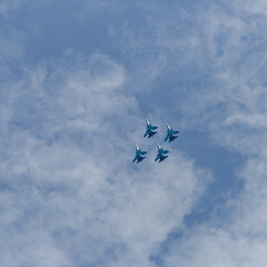 Four war jet planes in sky