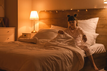 Little sleepwalker in bed at night