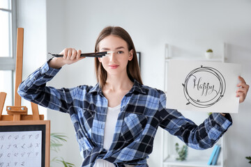 Portrait of female calligraphist in office