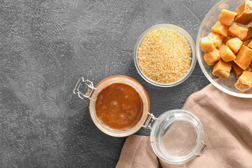 Composition with sweet caramel on table