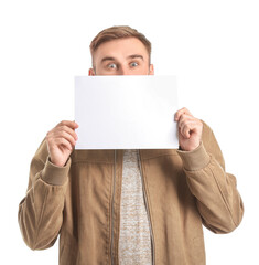 Surprised young man with blank card on white background