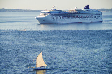 Modern NCL Norwegian Cruise Line cruiseship or cruise ship liner Norwegian Gem anchoring in bay on...