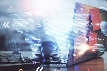 Multi exposure of table with computer and world map hologram. International data network concept.