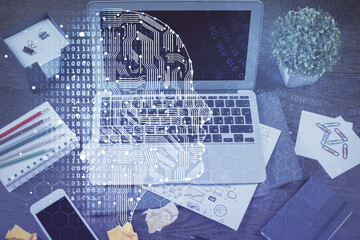 Multi exposure of work space with computer and human brain hologram. Brainstorm concept.