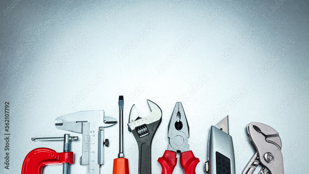 Canvas Prints set of various hand tools on grey background top view including different kinds of wrenches, pliers,