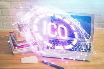 Multi exposure of blockchain theme hologram and table with computer background. Concept of bitcoin crypto currency.