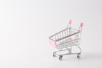 Shopping cart over white background