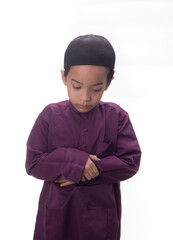 A Muslim kid with various poses isolated over white