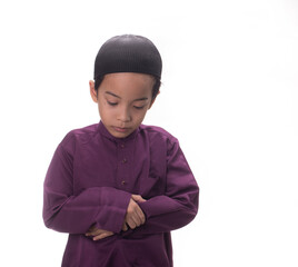 A Muslim kid with various poses isolated over white