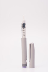 Insulin pen isolated over white