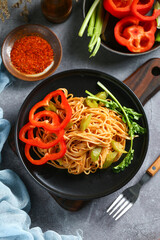 fried noodles in black plate