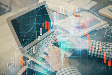 Double exposure of forex graph with man working on computer on background. Concept of market analysis.