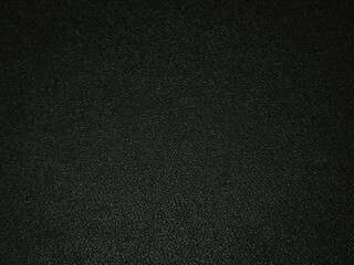 Dark black asphalt grunge surface, deep bumpy background.