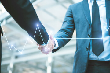Business people shaking hands, Greeting Deal Concept with Stock market or forex trading graph, modern city background.