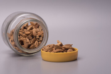 Cardamom herbs over grey background