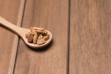 Cardamom herbs,over wooden background