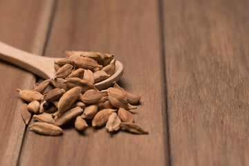 Cardamom herbs,over wooden background