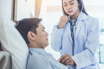 Doctor  having health problem of patient at hospital,medicine, doctor, healthcare and people concept