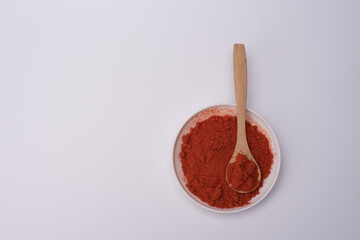 Chili poder over white surface