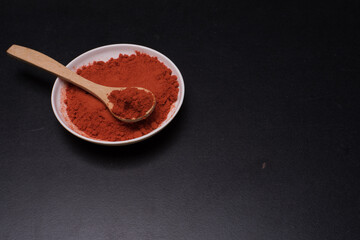 Chili powder over dark surface