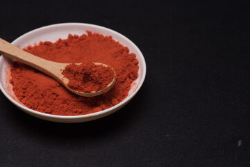 Chili powder over dark surface