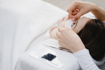 Master making fake set lash Eyelash extension procedure, work with patch for eye