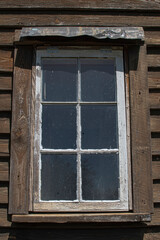 Old wooden window on a wooden wall