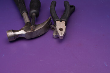 Set of tools isolated over purple surface
