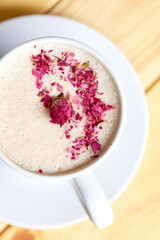 tasty cappuccono with rose petals